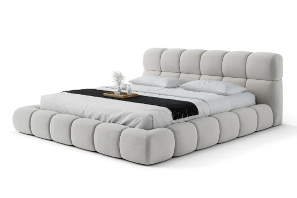 Cama Estofada Gommos AD Boutique com capitonê artesanal e estofamento premium, roupa de cama refinada, e bandeja decorativa.